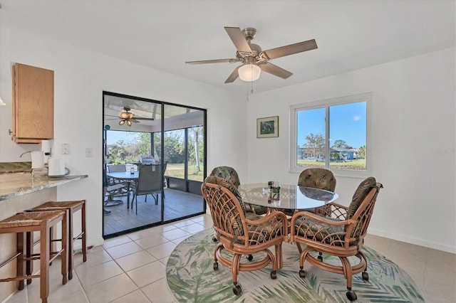 dining room featuring light tile patterned flooring and ceiling fan