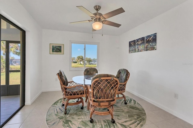 dining room with ceiling fan and light tile patterned floors