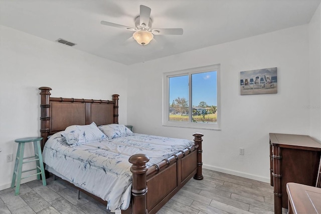 bedroom featuring light hardwood / wood-style flooring and ceiling fan