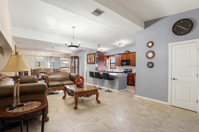 living room with an inviting chandelier and lofted ceiling