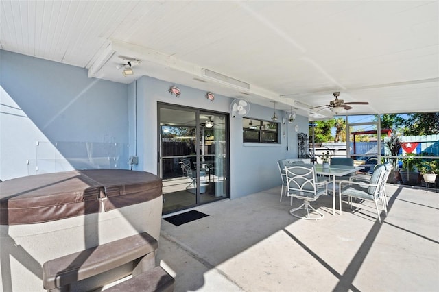 view of patio featuring a hot tub and ceiling fan