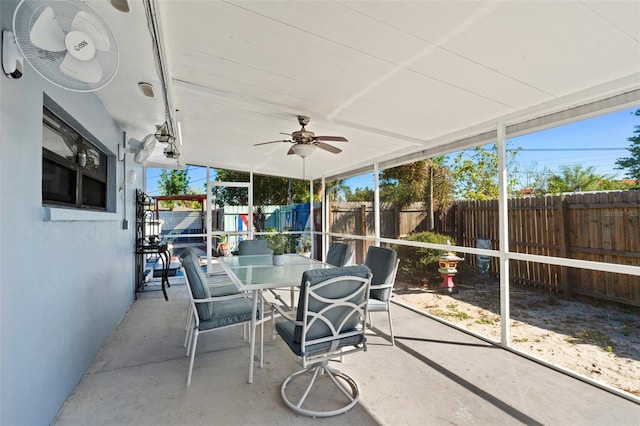 sunroom / solarium with ceiling fan and plenty of natural light