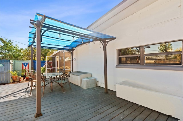 wooden deck with a pergola