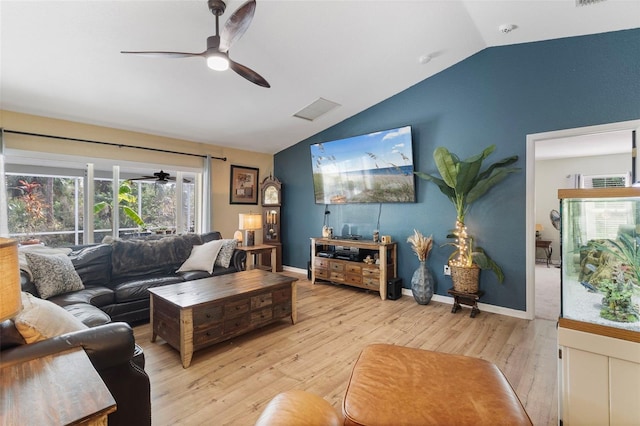 living room with light hardwood / wood-style floors, ceiling fan, and vaulted ceiling