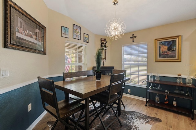 dining room featuring an inviting chandelier and light hardwood / wood-style floors