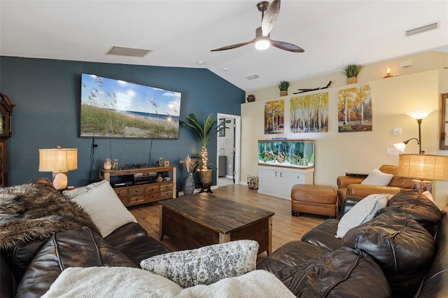 living room with vaulted ceiling, ceiling fan, and wood-type flooring