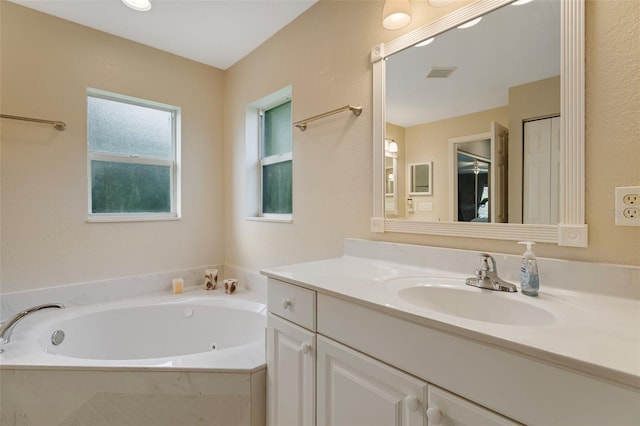 bathroom featuring vanity and a bathtub