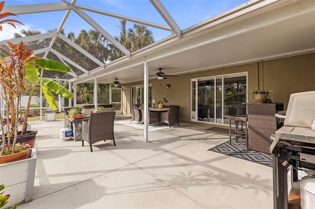 view of patio / terrace featuring a lanai and ceiling fan