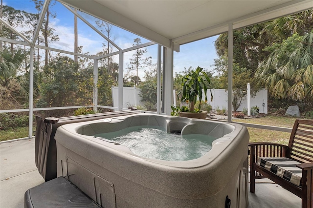 sunroom featuring a hot tub