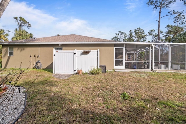 rear view of house with a yard