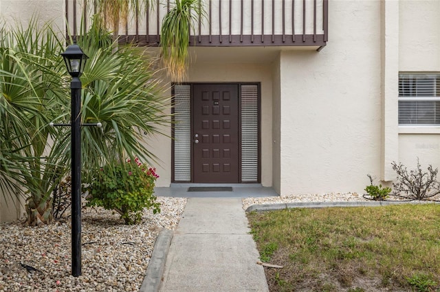 property entrance with a balcony