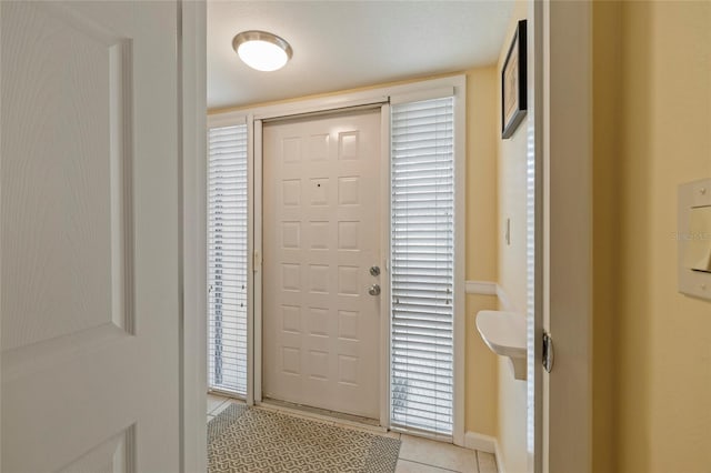 entryway featuring light tile patterned floors