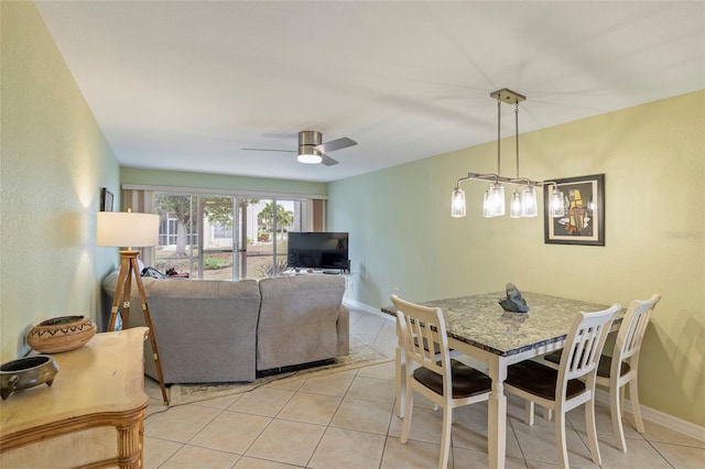 tiled dining room with ceiling fan