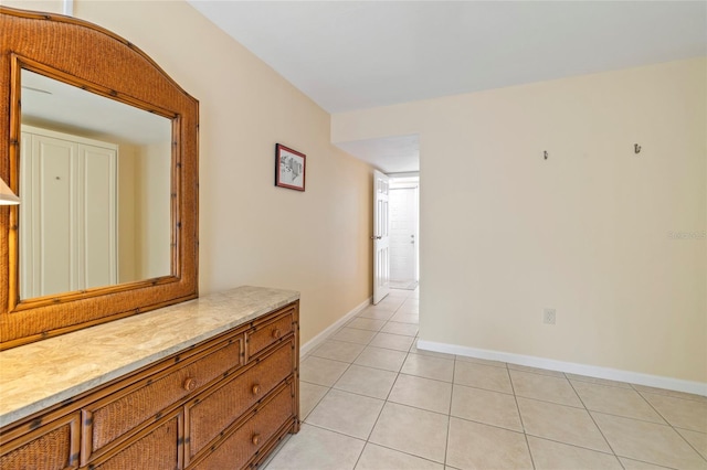 hallway with light tile patterned floors