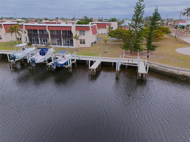 exterior space featuring a yard and a water view