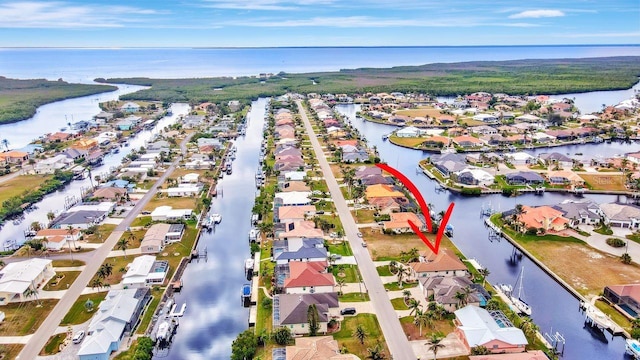 birds eye view of property featuring a water view