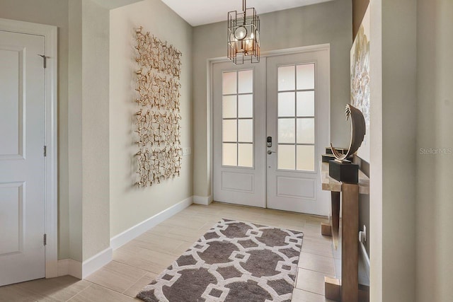 doorway with an inviting chandelier and french doors