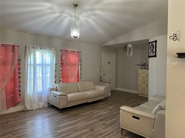 living room featuring lofted ceiling and hardwood / wood-style floors