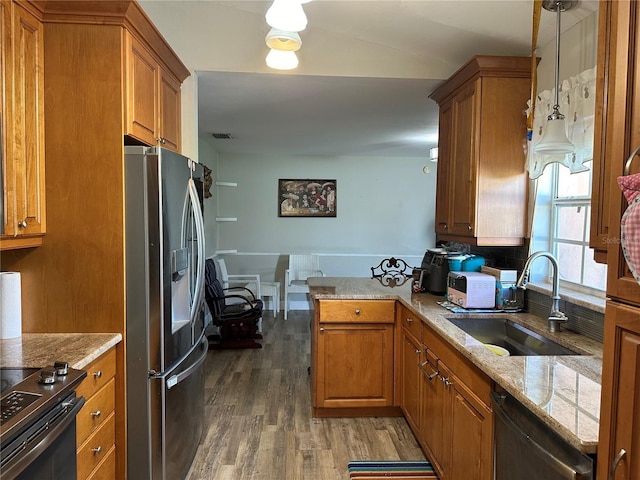 kitchen with pendant lighting, black range with electric cooktop, dark hardwood / wood-style floors, stainless steel refrigerator with ice dispenser, and sink