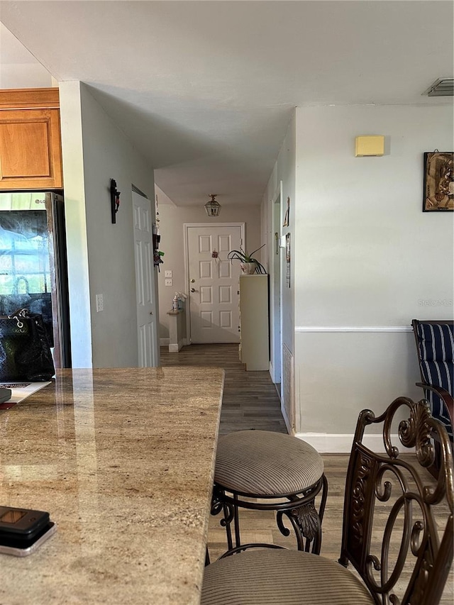 hallway featuring dark wood-type flooring