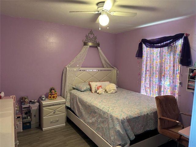 bedroom featuring ceiling fan and dark hardwood / wood-style floors