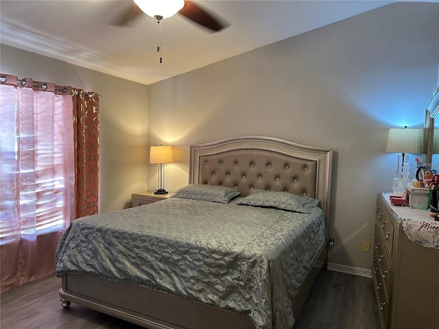 bedroom featuring ceiling fan and dark hardwood / wood-style floors