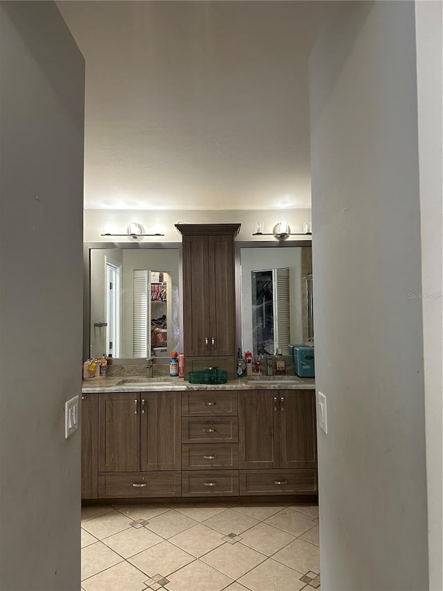 bathroom featuring tile patterned flooring and vanity