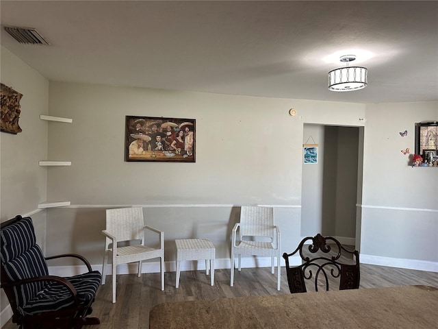 sitting room with hardwood / wood-style floors