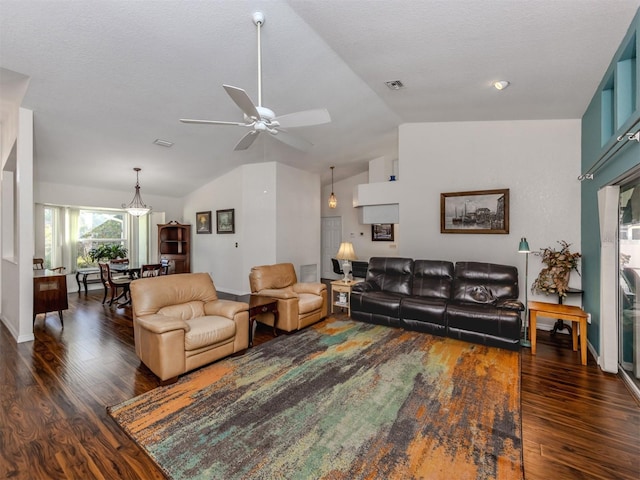 living room with vaulted ceiling, a textured ceiling, ceiling fan, and dark hardwood / wood-style flooring