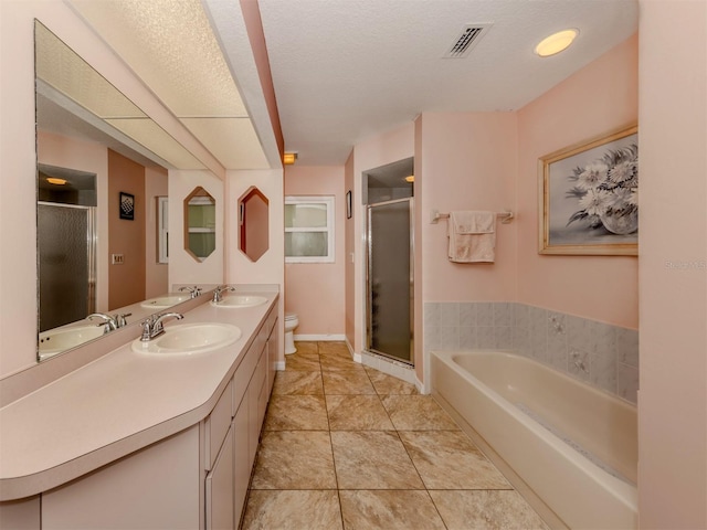 full bathroom featuring vanity, shower with separate bathtub, and toilet