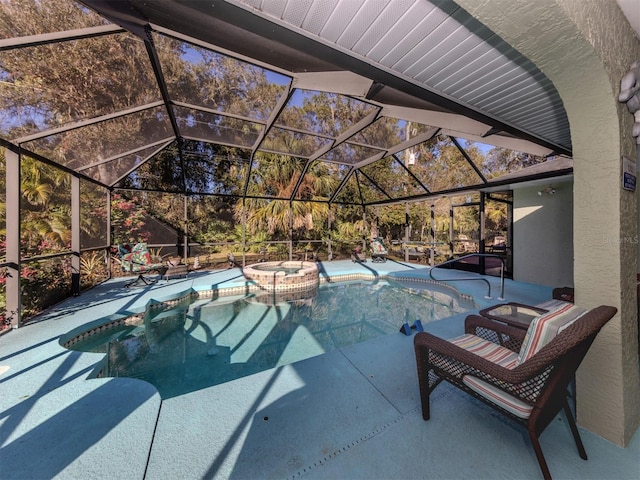 view of swimming pool featuring glass enclosure and an in ground hot tub