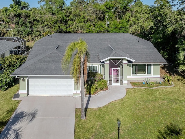 3341 Briant St, North Port, FL 34287 - ranch-style house with stucco siding, driveway, an attached garage, a front lawn, and roof with shingles