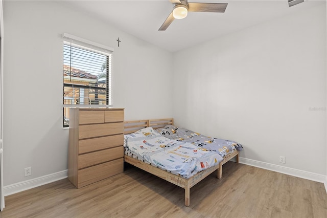 bedroom featuring ceiling fan and light hardwood / wood-style flooring