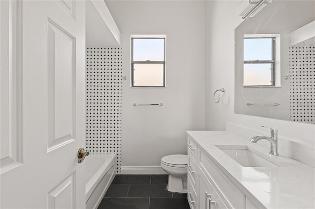 full bathroom featuring tile patterned floors, vanity, toilet, and a wealth of natural light