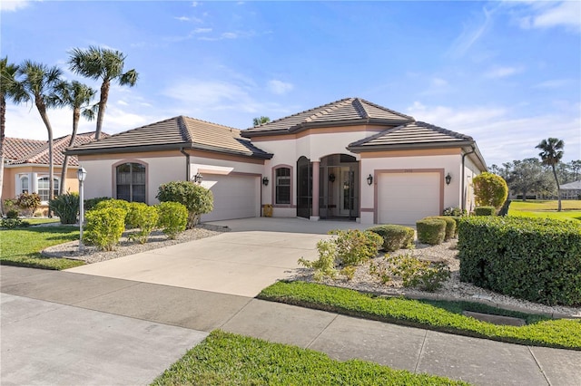 mediterranean / spanish-style house featuring a garage