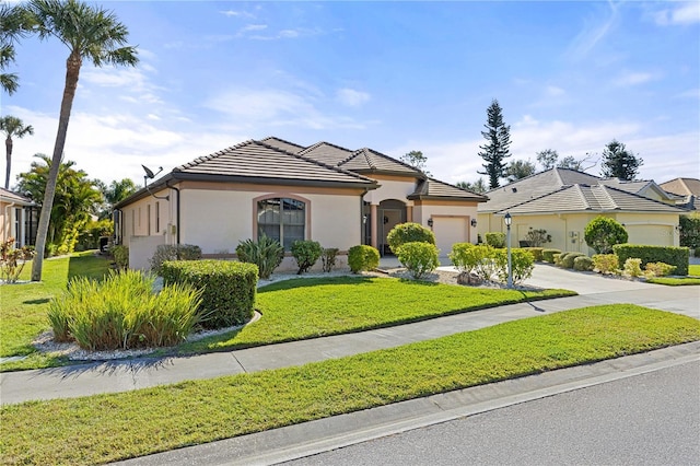 view of front facade featuring a front yard and a garage