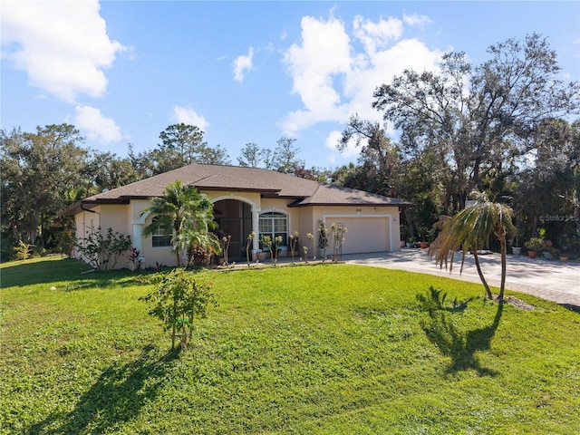 view of front of property with a front lawn and a garage