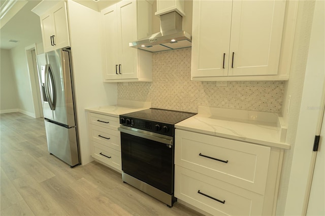 kitchen with range with electric cooktop, stainless steel fridge with ice dispenser, exhaust hood, light hardwood / wood-style floors, and light stone counters