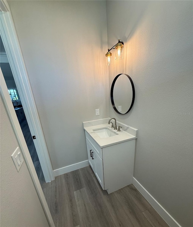 bathroom with vanity and hardwood / wood-style flooring