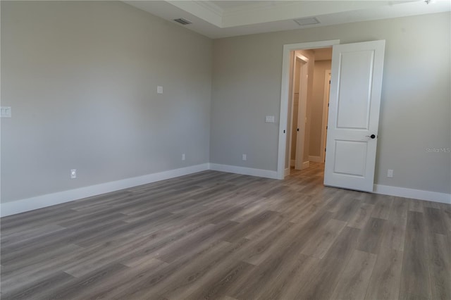 spare room featuring hardwood / wood-style floors