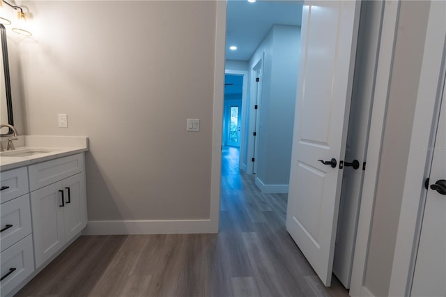 bathroom featuring vanity and hardwood / wood-style floors