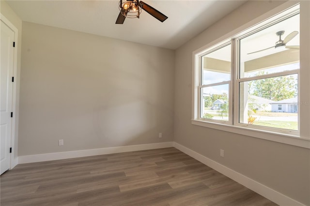 empty room featuring hardwood / wood-style flooring and ceiling fan