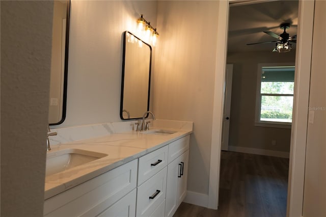 bathroom with vanity, hardwood / wood-style floors, and ceiling fan