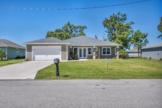 view of front of property featuring a garage, fence, driveway, french doors, and a front yard