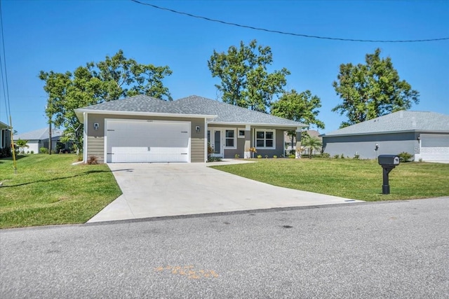 ranch-style home featuring a garage, a front yard, roof with shingles, and driveway