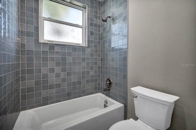 bathroom featuring toilet and bathing tub / shower combination