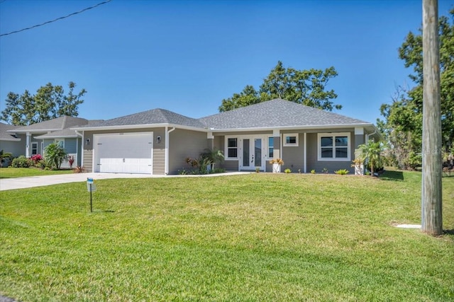 single story home featuring a front yard, french doors, driveway, and an attached garage