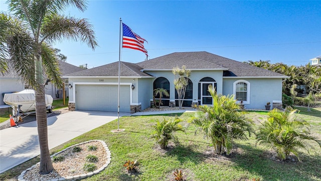 ranch-style house with a front yard and a garage