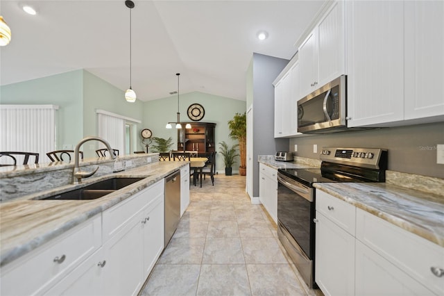 kitchen with decorative light fixtures, stainless steel appliances, white cabinets, and sink