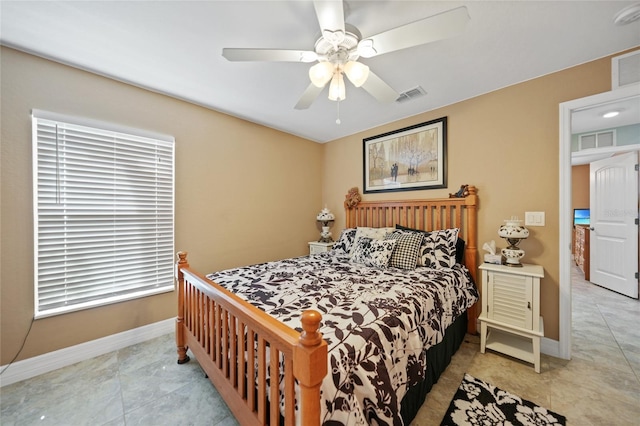 tiled bedroom with ceiling fan